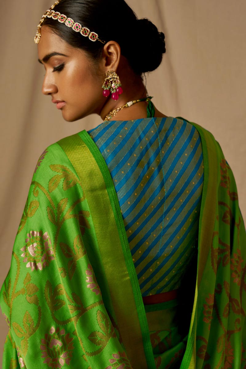 Amazing Weaving Work On Green Brasso Fabric Saree