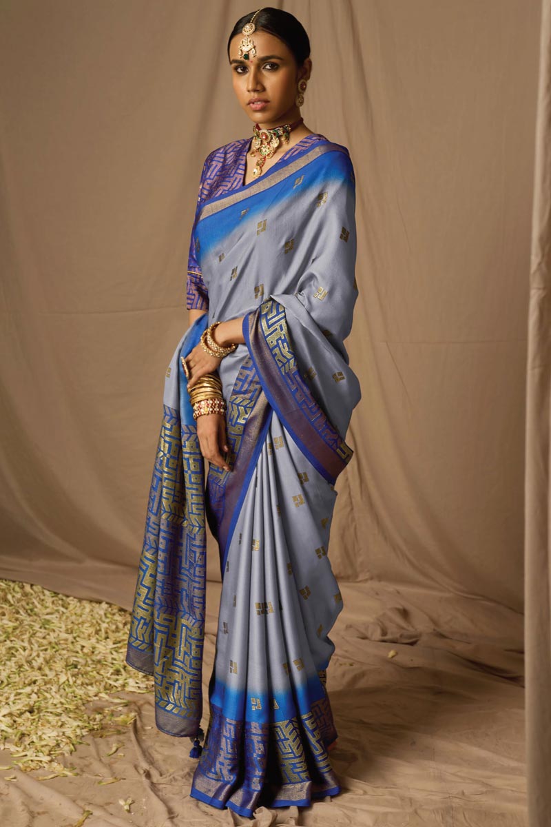 Trendy Brasso Fabric Blue Saree With Weaving Work