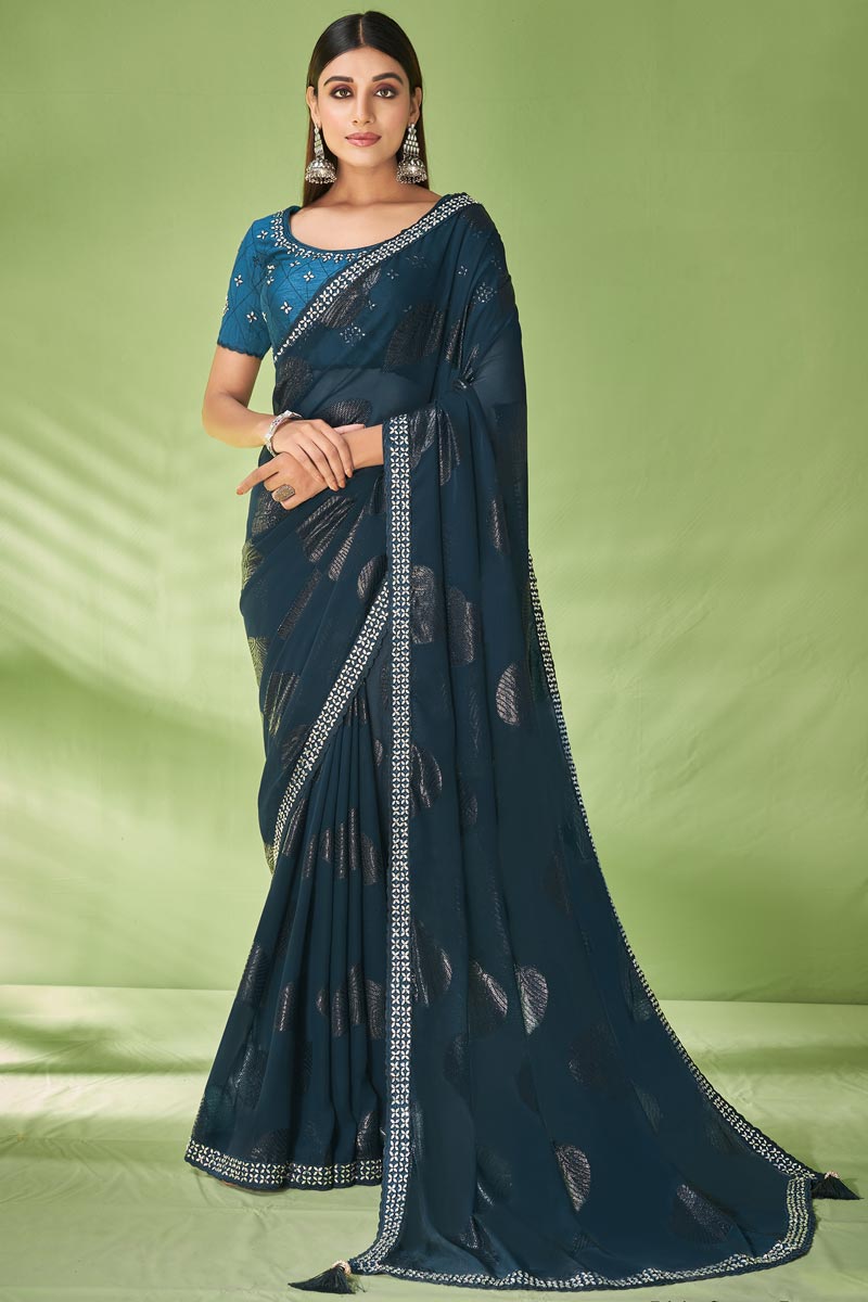 Fantastic Foil Printed Georgette Saree In Teal Color
