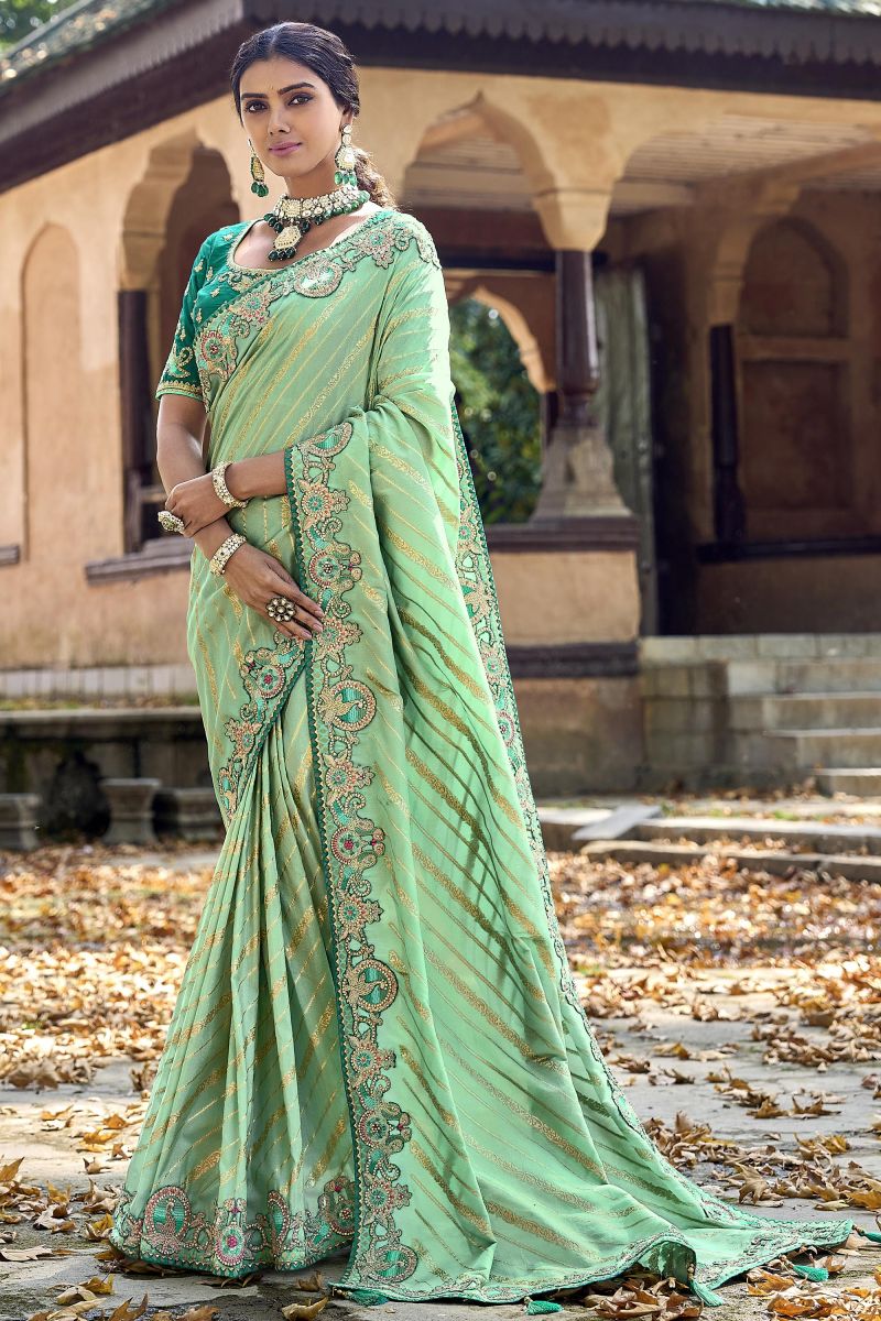 Dazzling Sea Green Silk Saree With Heavy Embroidered Blouse