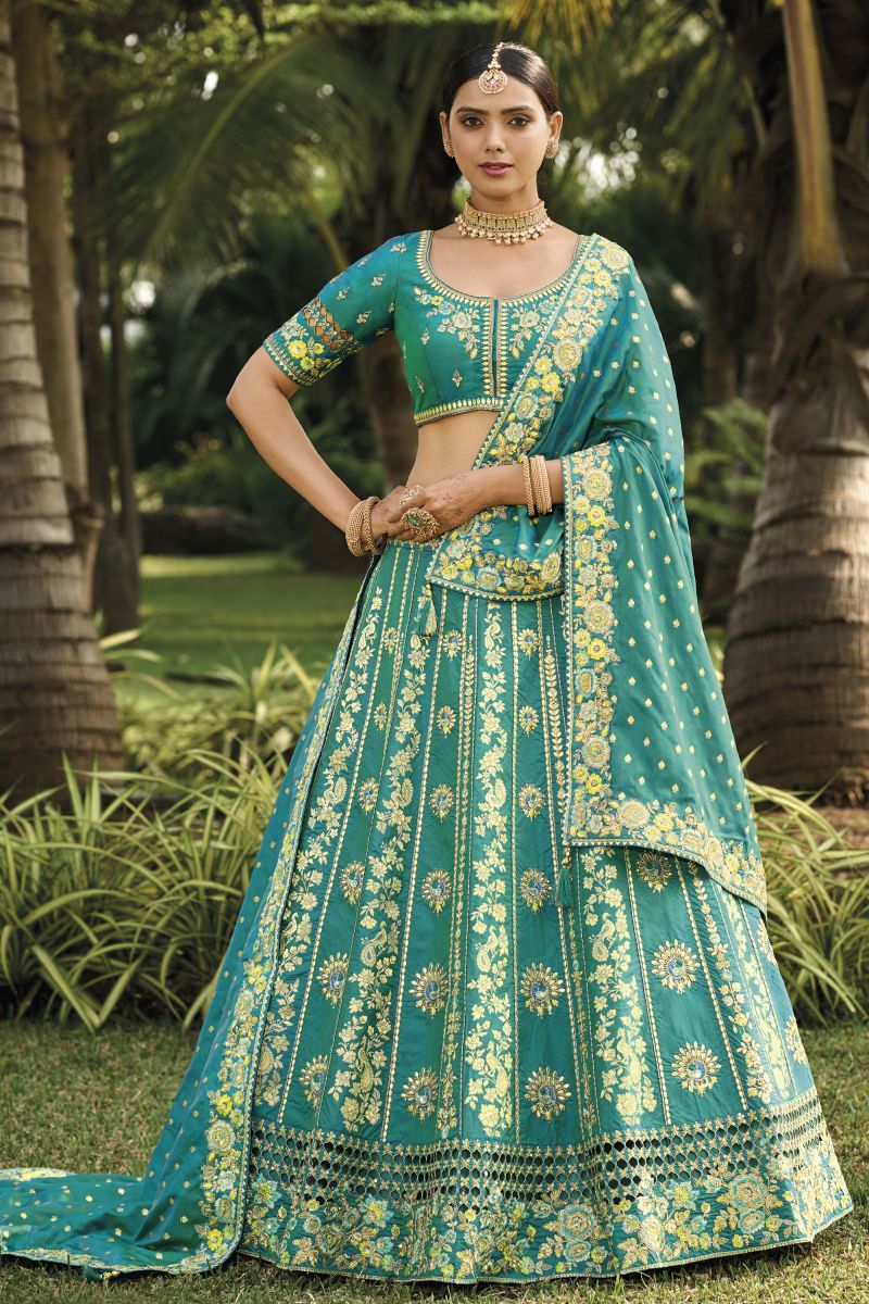 Jacquard Work On Banarasi Silk Bewitching Lehenga In Sea Green Color