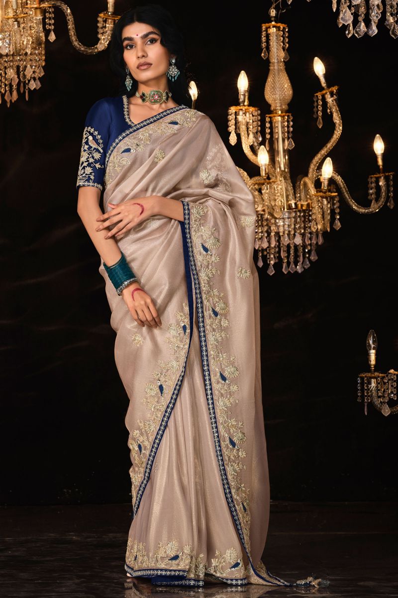 Fancy Fabric Beige Color Riveting Saree With Embroidered Work