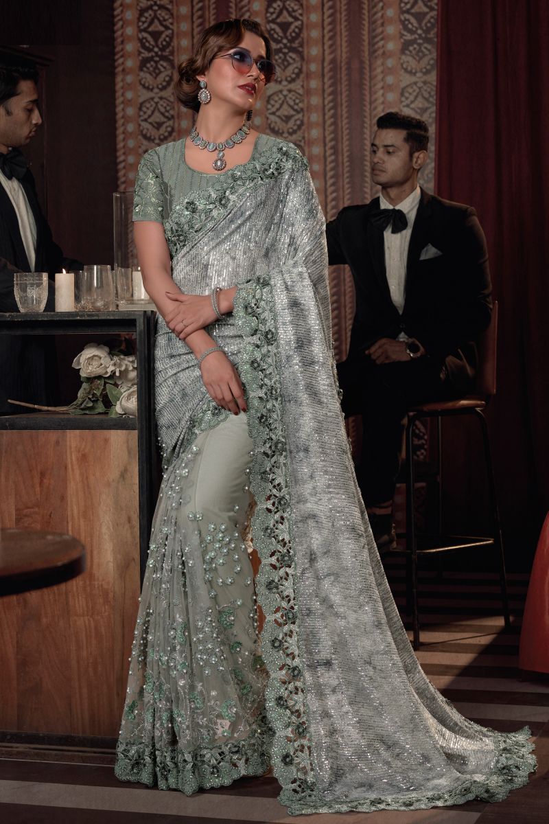 Heavy Embroidery Work Beguiling Sea Green Color Net Saree