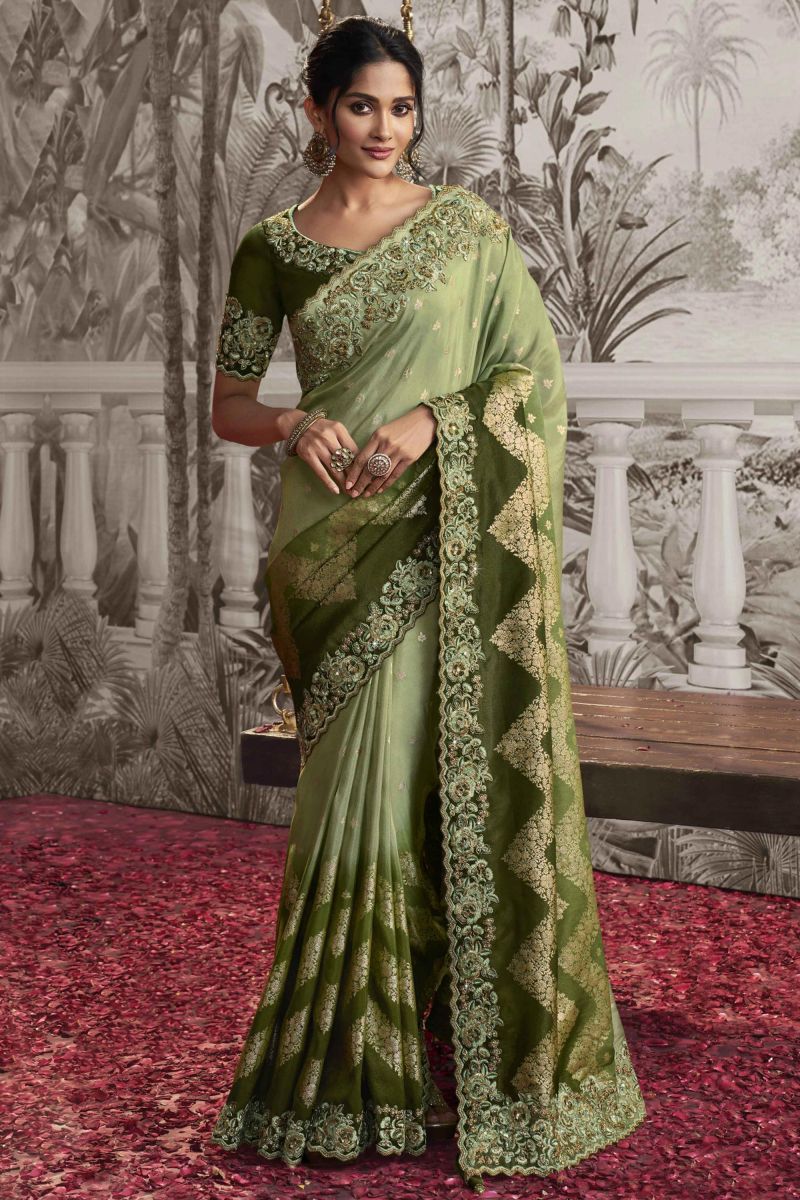 Heavy Embroidery Work Engaging Green Color Fancy Fabric Saree With Party Look Blouse