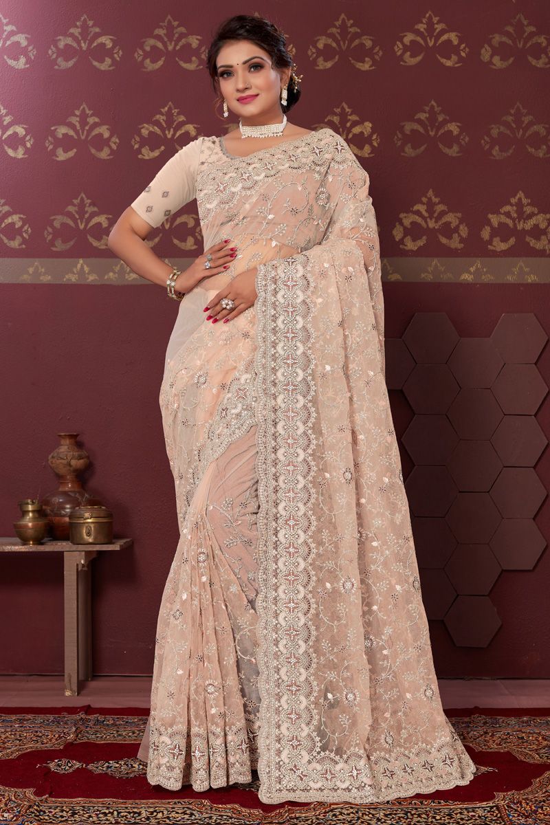 Intriguing Peach Color Embroidered Saree In Net Fabric