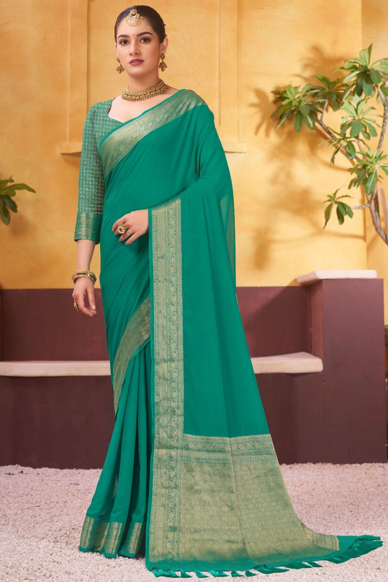 Weaving Border Work On Teal Color Wedding Wear Georgette Fabric Saree