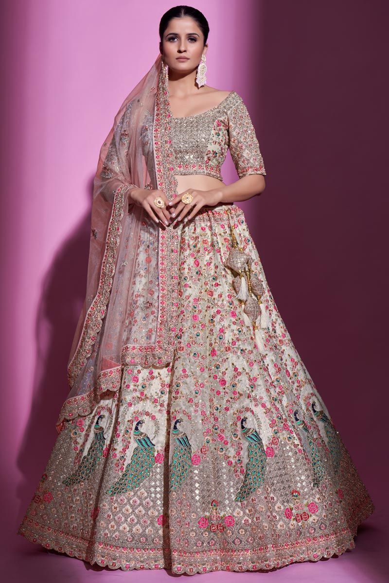 Vivacious Net Fabric Lehenga In Cream Color