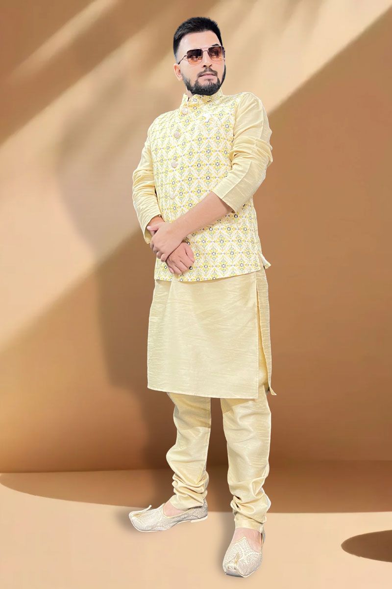 Attractive Function Wear Cream Kurta Pyjama With Yellow Jacket In Silk Fabric