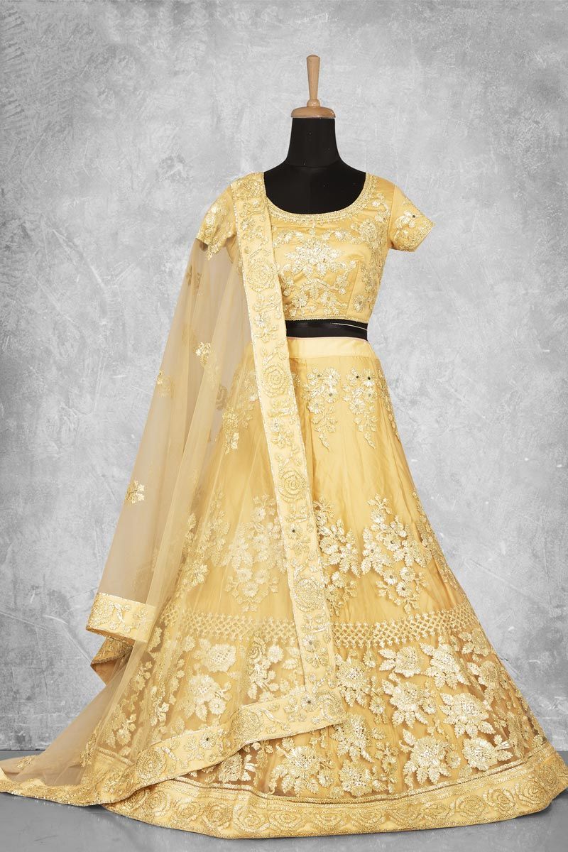 Net Fabric Yellow Color Lehenga With Winsome Embroidered Work