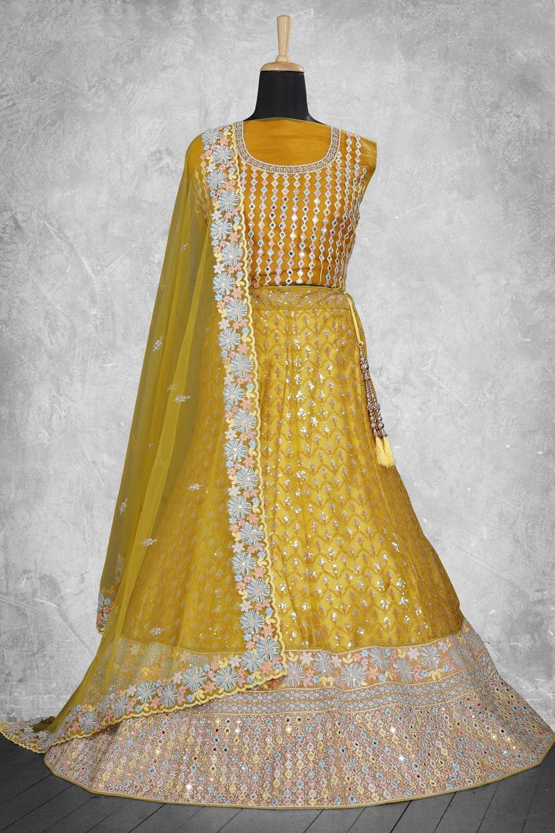 Net Fabric Lehenga In Mustard Color With Embroidered Work