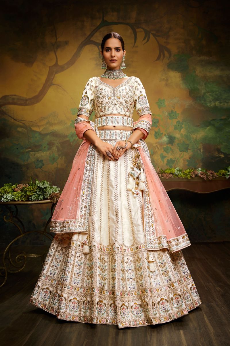 Off White Embroidery Work Silk Wedding Wear Lehenga With Enchanting Blouse