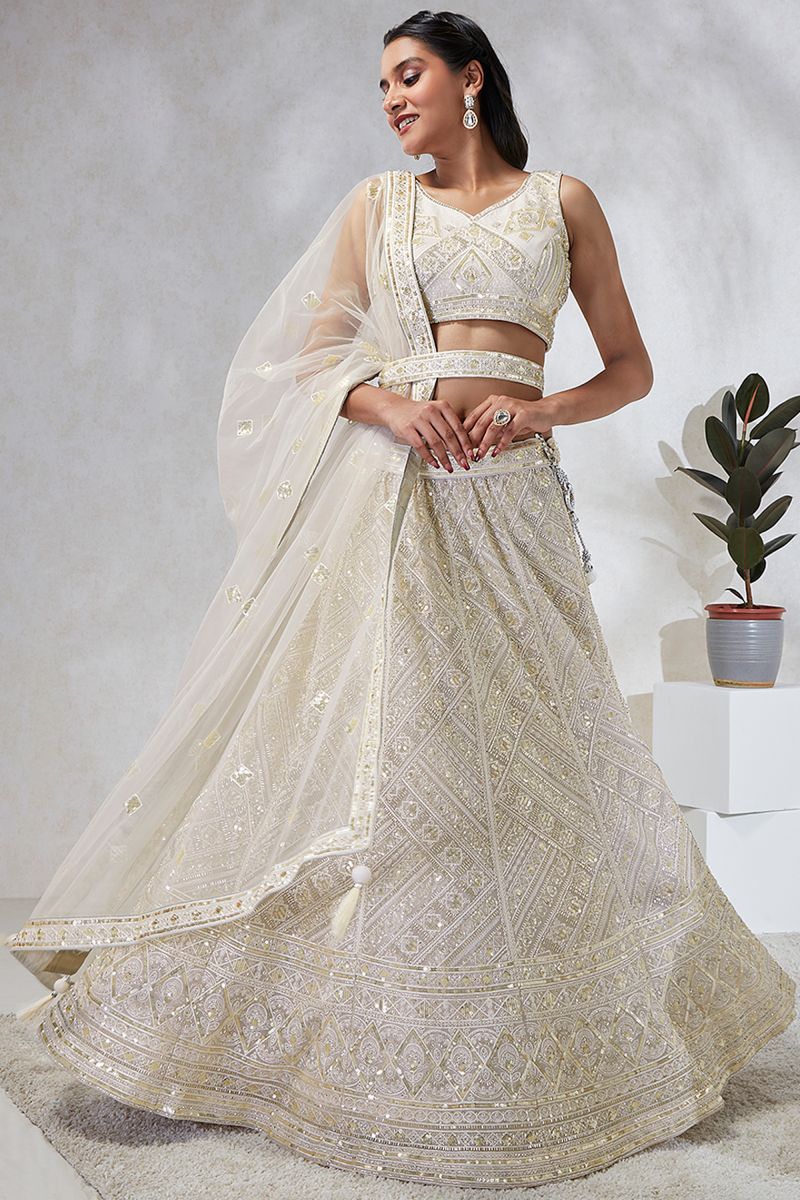 Cream Sequins Work Designs Wedding Wear Lehenga And Enigmatic Blouse