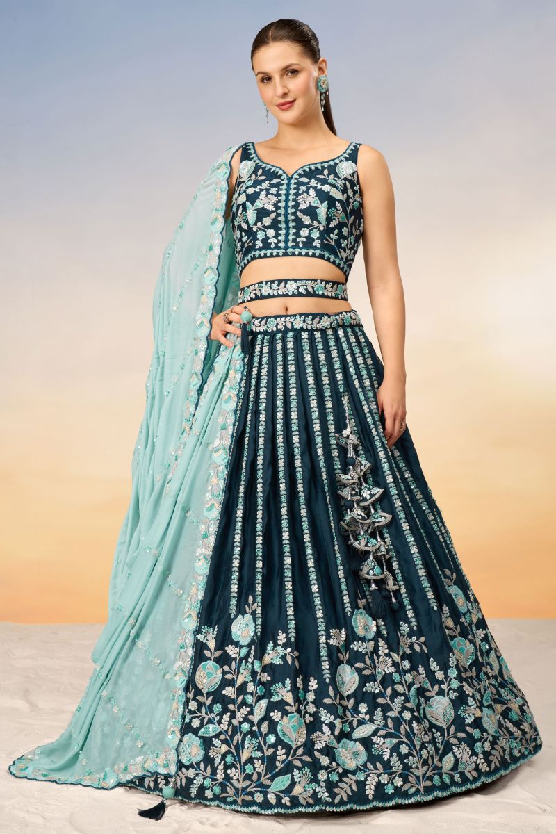 Teal Designer Lehenga With Sequins Work Designs And Enigmatic Blouse