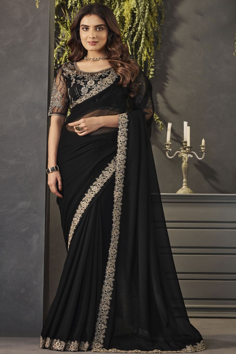 Exclusive Georgette Fabric Black Color Lace Border Work Saree With Embroidered Blouse