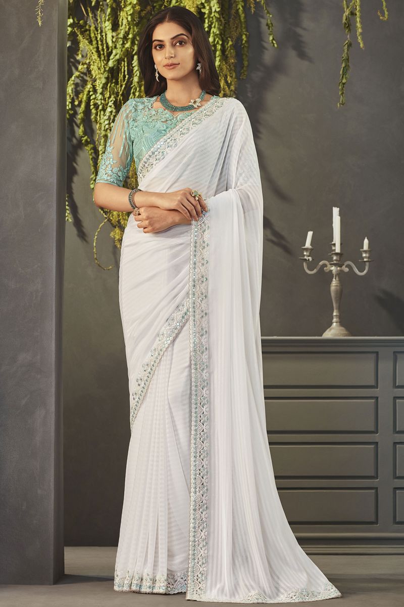 Beautiful Georgette Fabric Off White Color Lace Border Work Saree With Embroidered Blouse