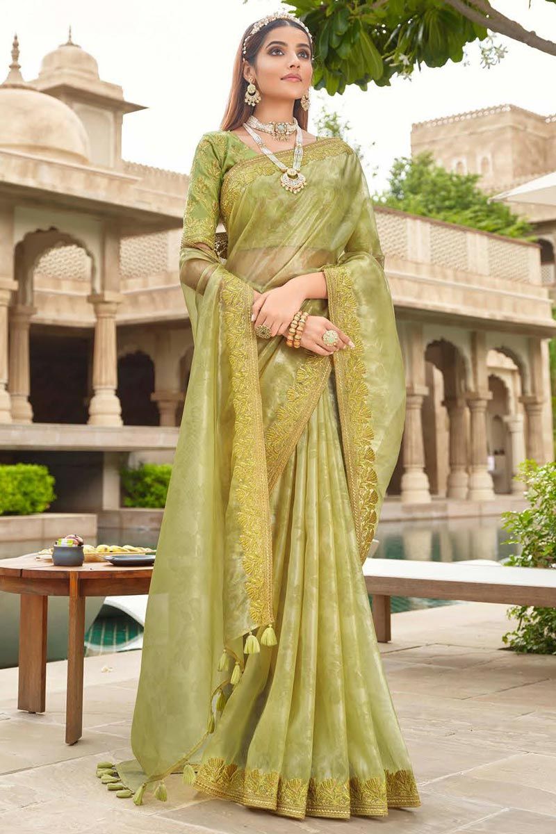 Tissue Silk Fabric Intriguing Festive Saree In Green Color