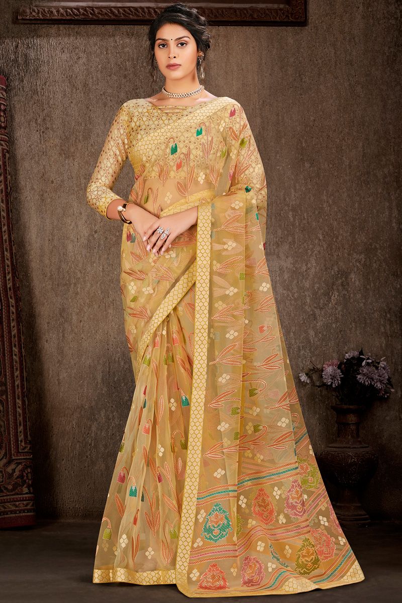 Mustard Color Foil Printed Work On Engaging Brasso Saree