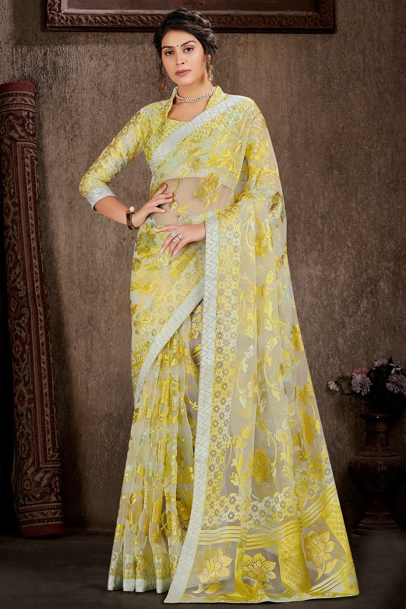 Foil Printed Work On Yellow Color Saree In Brasso Fabric