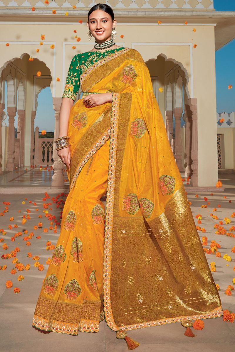 Wedding Wear Organza Fabric Yellow Color Weaving Work Saree With Heavy Embroidered Blouse