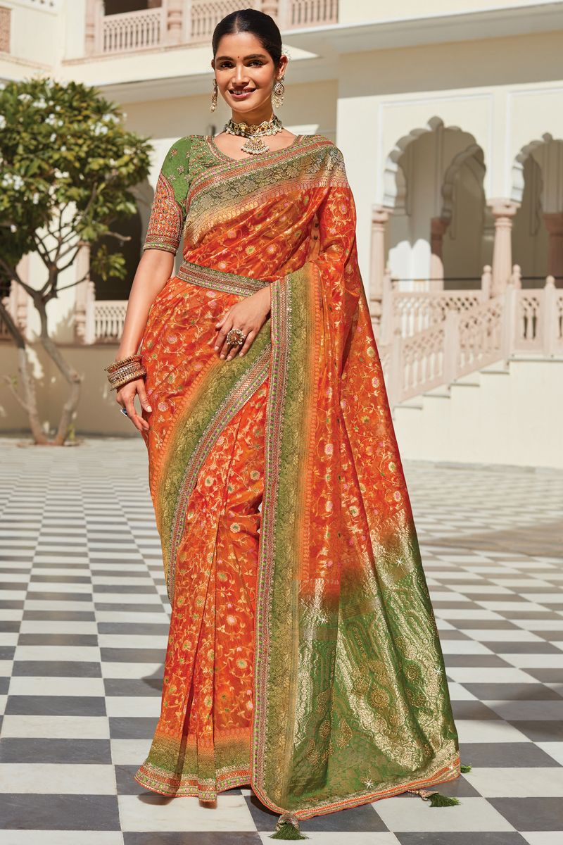 Sangeet Wear Organza Fabric Orange Color Weaving Work Saree With Heavy Embroidered Blouse