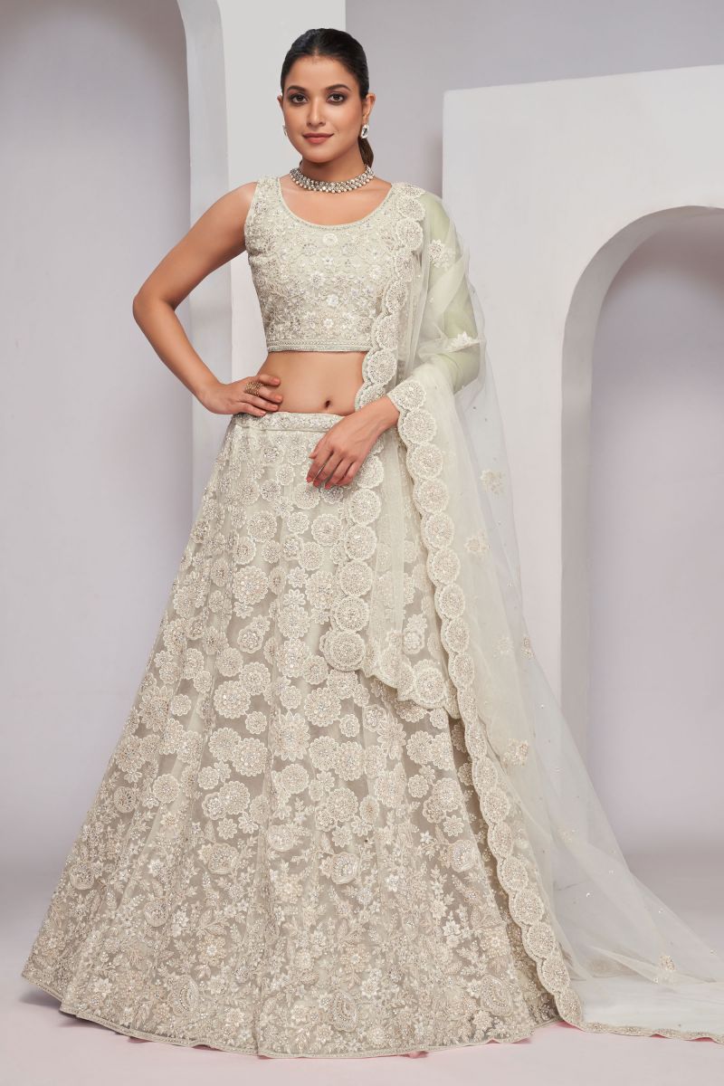 Excellent Net Fabric Beige Color Lehenga With Sequins Work