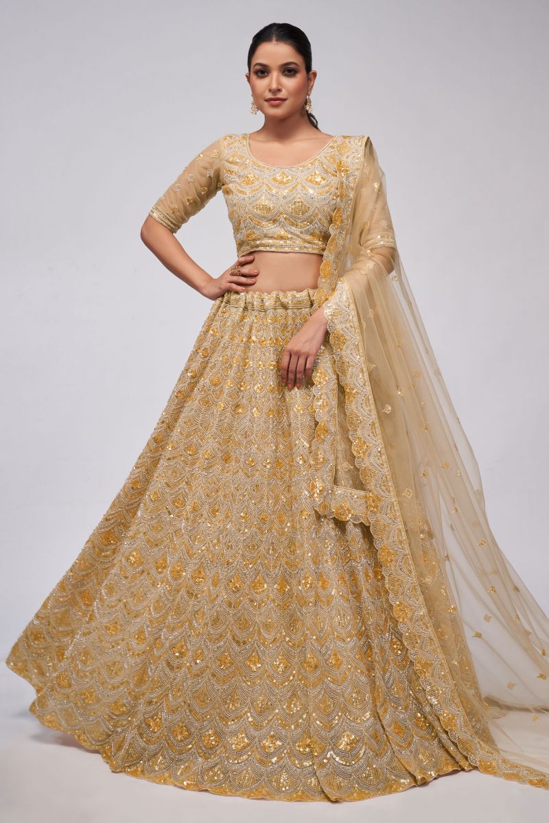 Tempting Net Fabric Golden Color Lehenga With Sequins Work